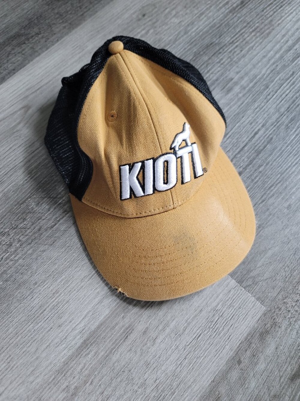 Mens beige and black Kioti hat - has spot/damage - Haltom Equipment